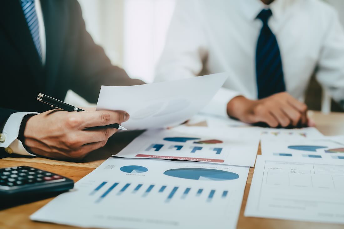 Advisor showing plan of investment to clients 