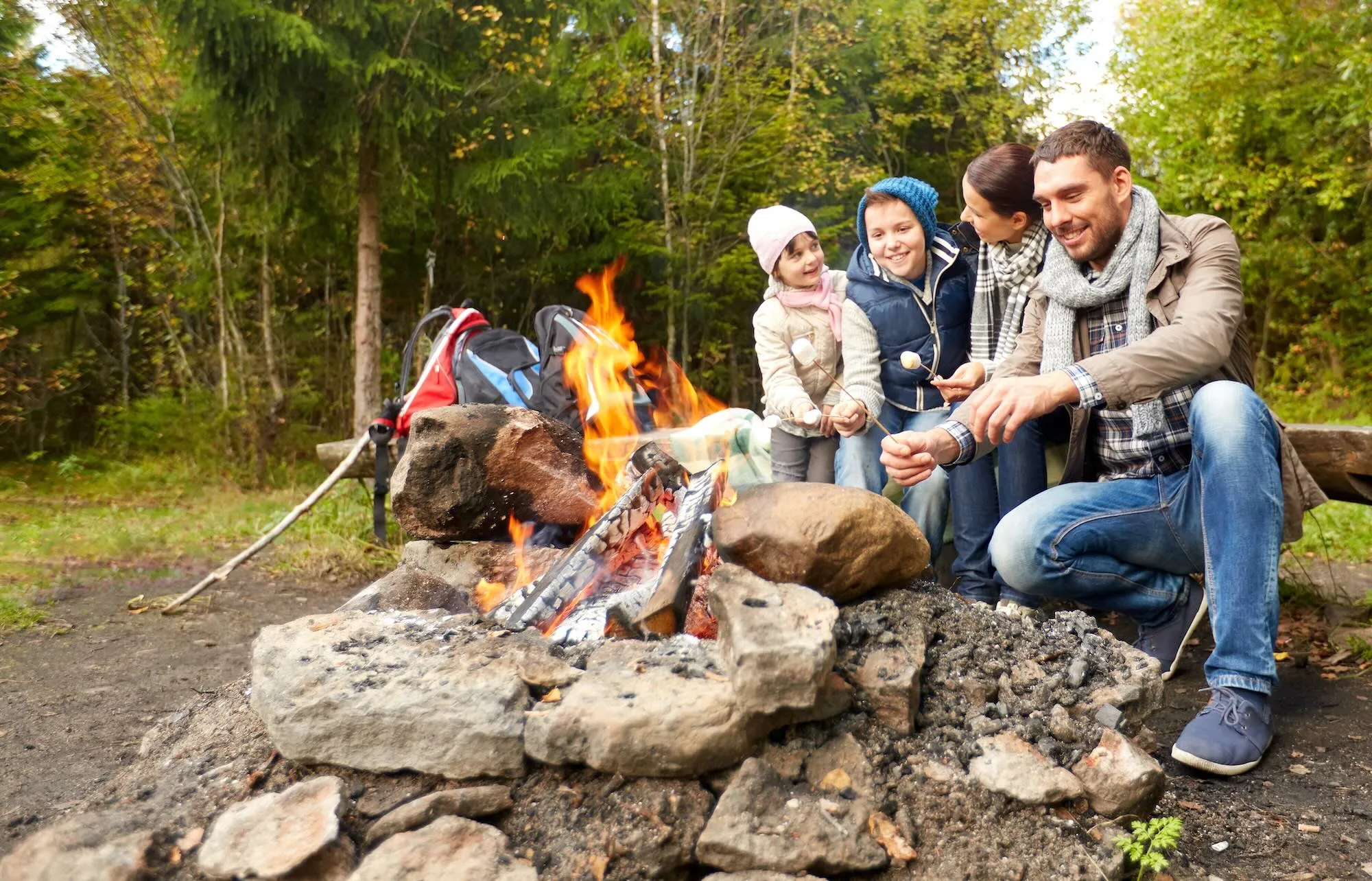 happy family camping in the forest